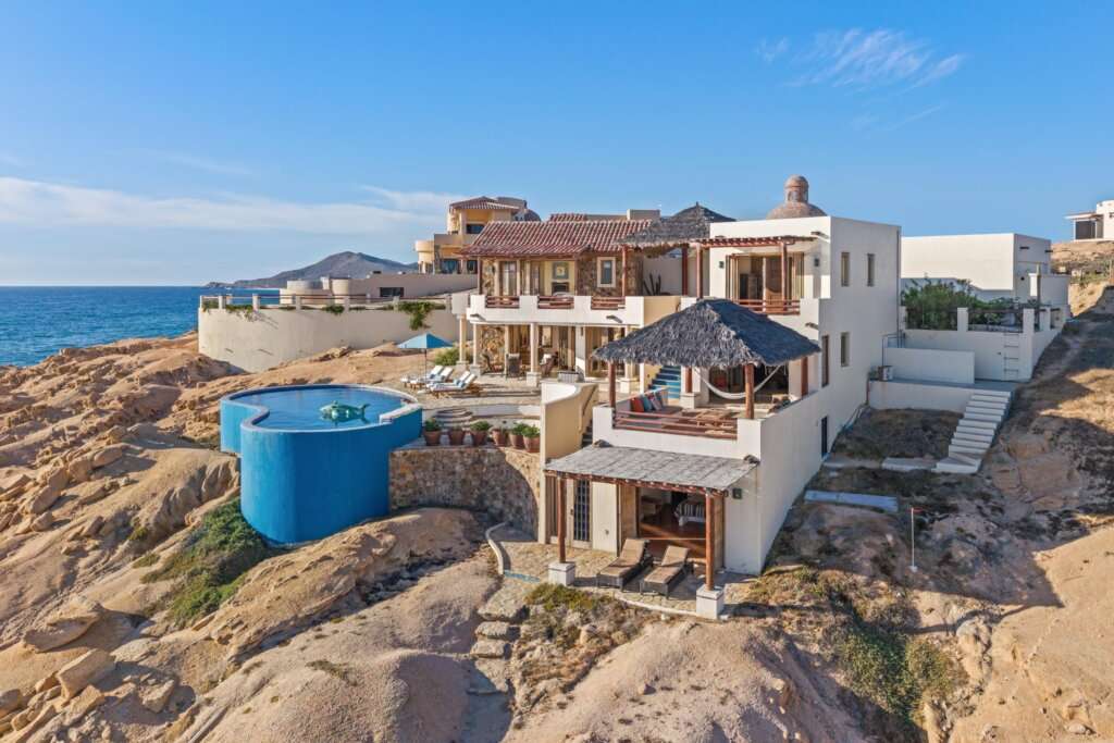 Cabo Luxury Rancholasmargaritas Casa Playa Escondida - Oceanfront Luxury in Baja California SurPerched dramatically on the rocks above the Pacific Ocean, Casa Playa Escondida is a rare oceanfront retreat set along a secluded, pristine stretch of beach. Located within the exclusive off-grid gated community of Rancho Las Margaritas, this one-of-a-kind property offers privacy, tranquility, and breathtaking natural beauty--just a 20-minute drive to the dining and shopping of Cabo San Lucas, 40 minutes from Los Cabos International Airport, and approximately 30 minutes south of Cerritos and Todos Santos.The residence features three spacious ensuite bedrooms, each privately situated yet connected by terraces, pathways, and shared gathering spaces. A dedicated media room offers flexibility as a fourth bedroom or additional guest suite.Expansive terraces and multiple lounging areas provide a variety of vantage points to take in the surrounding landscape, from the rugged coastline to the endless Pacific horizon.The gourmet kitchen is equipped with high-end appliances and designed for both functionality and style. A warm and inviting living and dining area, anchored by a striking fireplace, creates the perfect space for entertaining or relaxing with family and friends. The home is offered fully furnished with includes modern off-grid conveniences such as solar power.Outdoor living is equally exceptional, featuring a swimming pool, firepit, grilling area, and multiple seating spaces--ideal for enjoying the serene coastal setting for sale