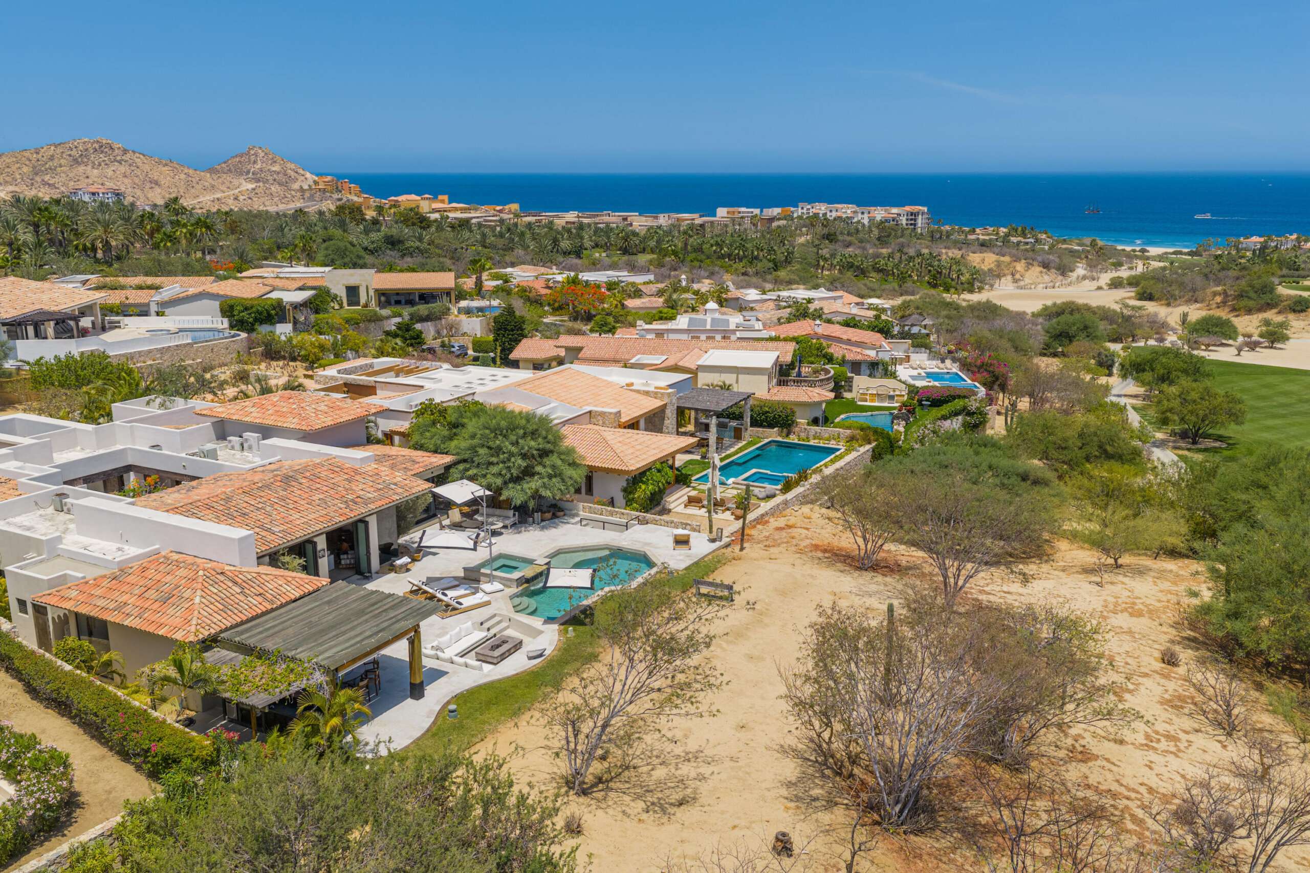 Cabo Luxury Brisas Discover Naah Payil, an exceptional estate where the warmth of a Contemporary Mexican Hacienda blends seamlessly with the relaxed sophistication of coastal living. Located within one of Los Cabos' most exclusive and secure communities, this architectural masterpiece was custom-designed by MCA, led by renowned architect Antonio Carrera. Thoughtfully enhanced in 2015 and again in 2025, the residence beautifully balances timeless character with today's highest standards of comfort and design. At the heart of the home, a central courtyard anchored by a signature tree creates a tranquil gathering space filled with natural light. The home's thoughtful design embraces effortless indoor-outdoor living. Open the grand living room doors, and refreshing ocean breezes naturally flow throughout the residence, creating a comfortable and inviting atmosphere – 12 Cabo del Sol Brisas, Cabo Corridor, BS